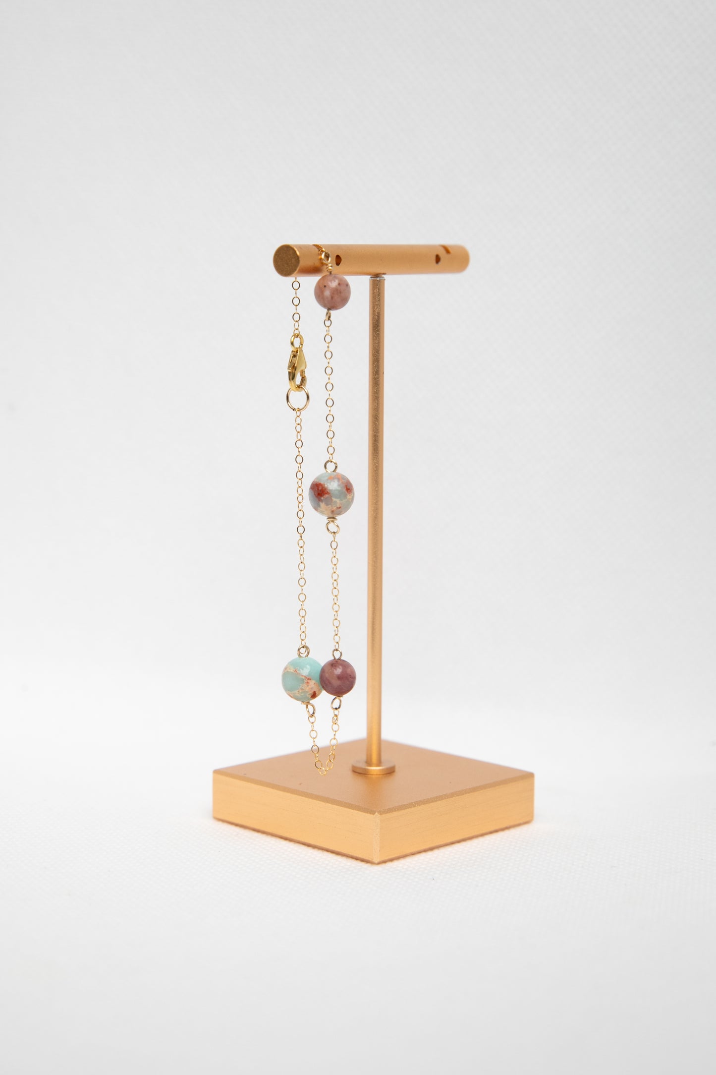 A jewellery display stand with the Elvire bracelet handcrafted by Atelier Seve. 