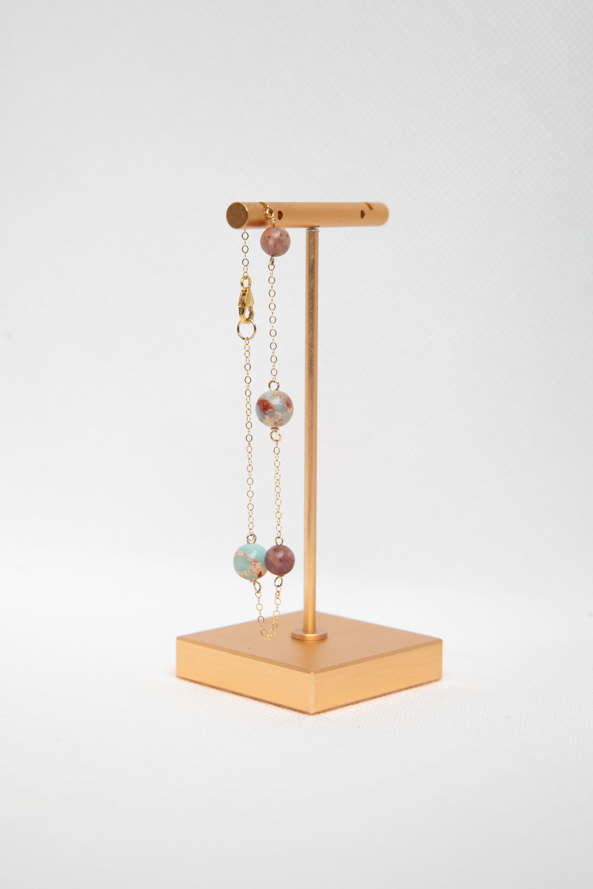 A jewellery display stand with the Elvire bracelet handcrafted by Atelier Seve. 