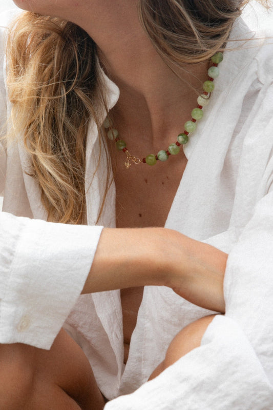 Bohemian girl wearing a necklace with semi-precious stones and Mediterranean inspiration