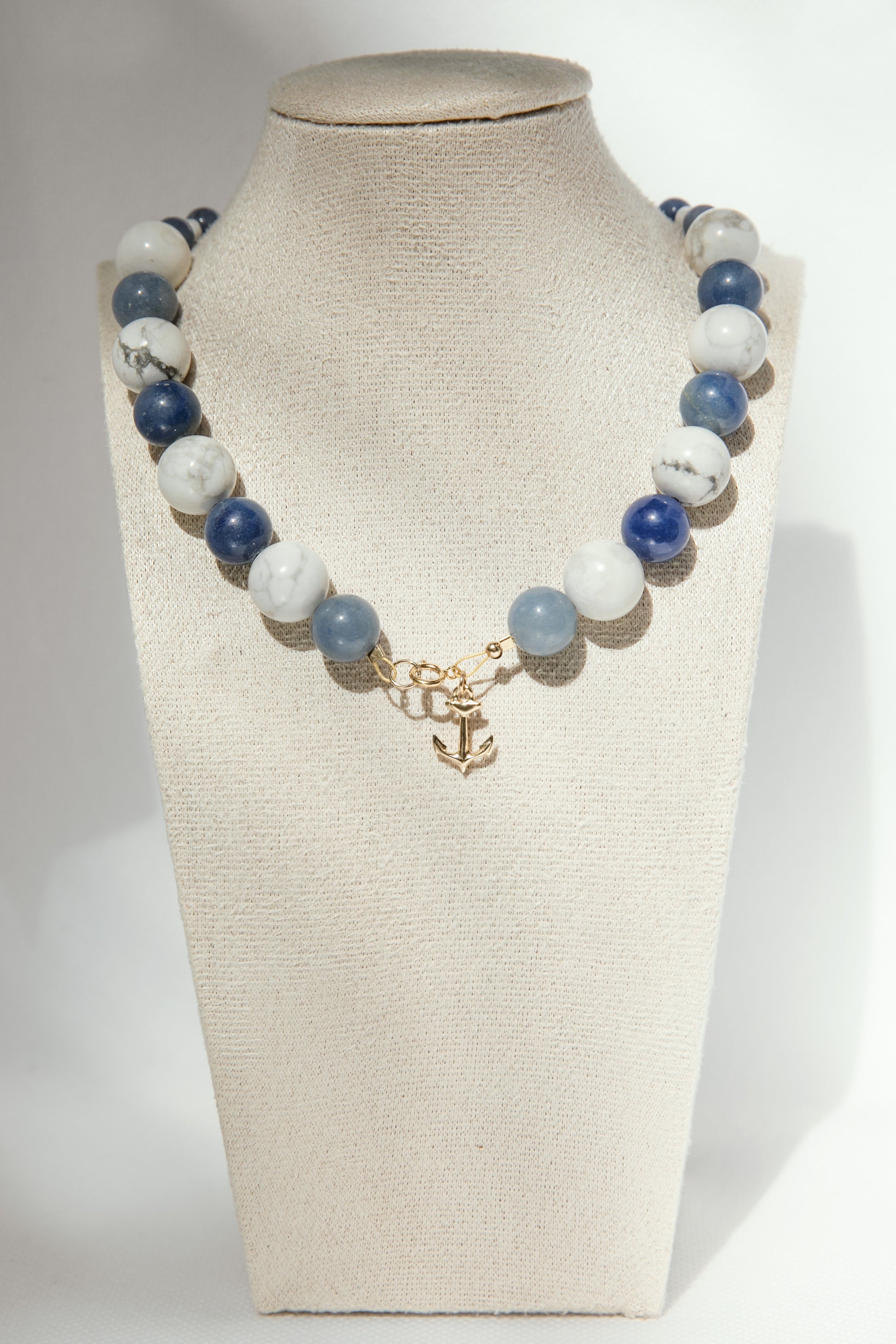 Handmade necklace inspired by boats and little ports of the Mediterranean. It is composed of semi-precious stones blue aventurine and howlite with a gold-filled anchor. 