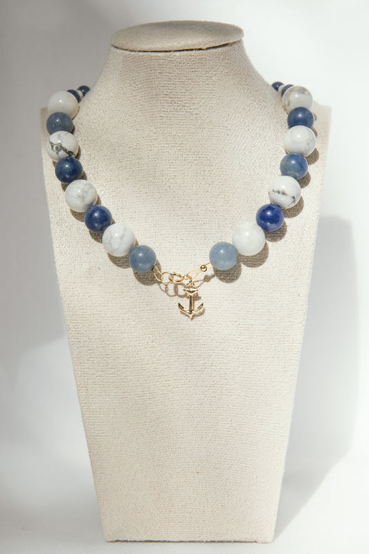 Handmade necklace inspired by boats and little ports of the Mediterranean. It is composed of semi-precious stones blue aventurine and howlite with a gold-filled anchor. 
